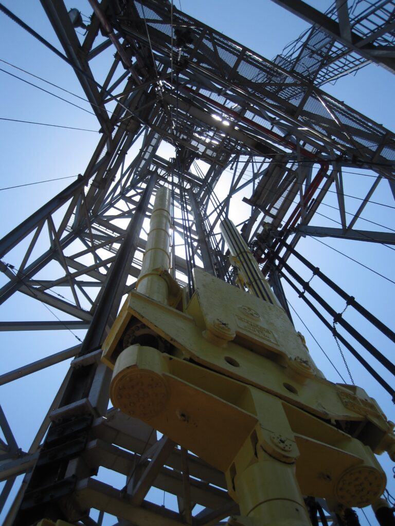 Upward view through the steel drilling derrick aboard the research vessel JOIDES Resolution.